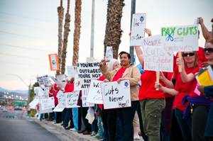 Teachers gather in front of the Clark County School District ...